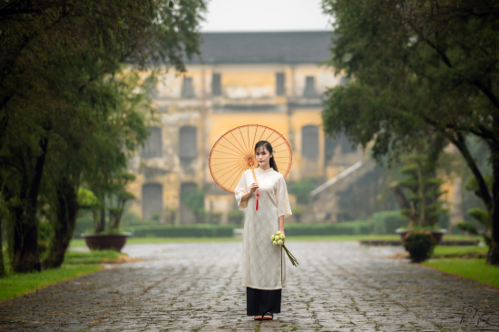 Following Tourists Taking Photos in Ao dai at An Dinh Palace